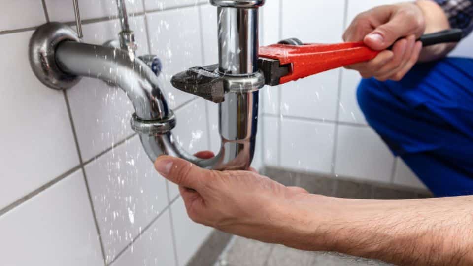 Plumber with wrench