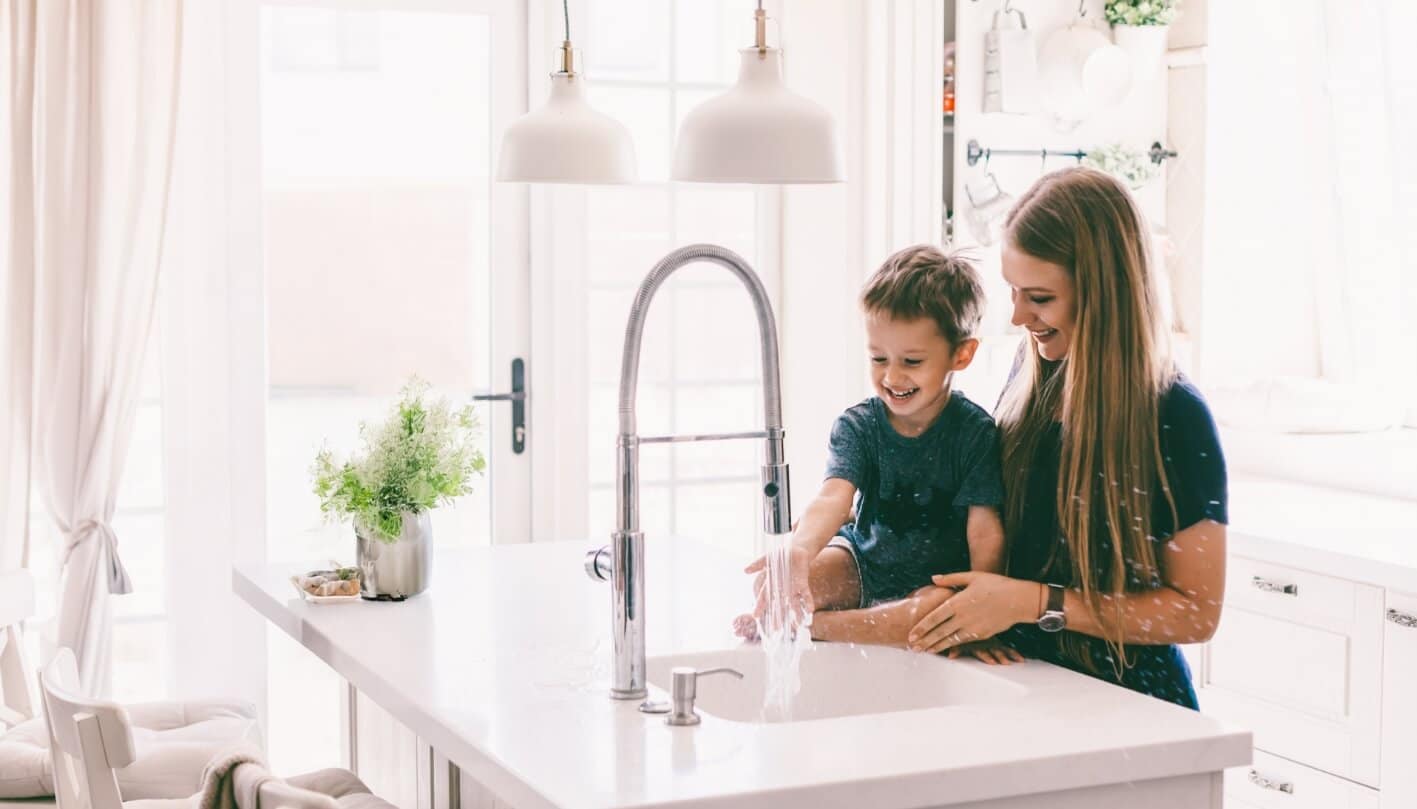 mon-and-son-using-sink