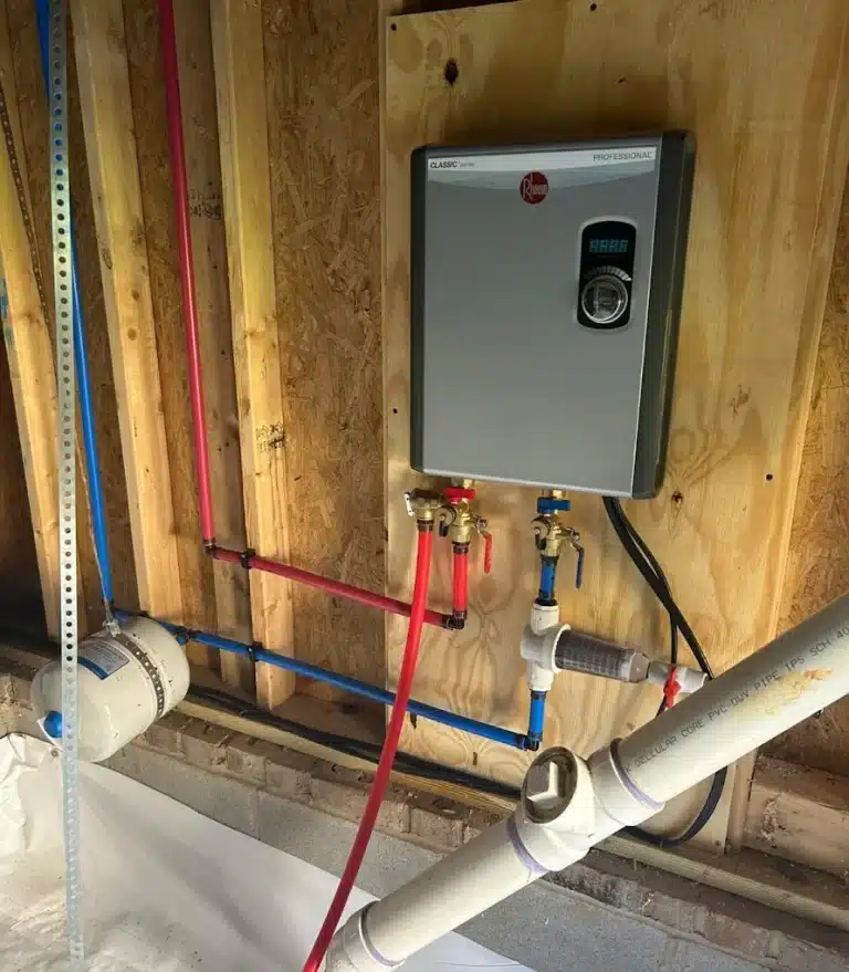 Tankless water heater on the wall in a garage